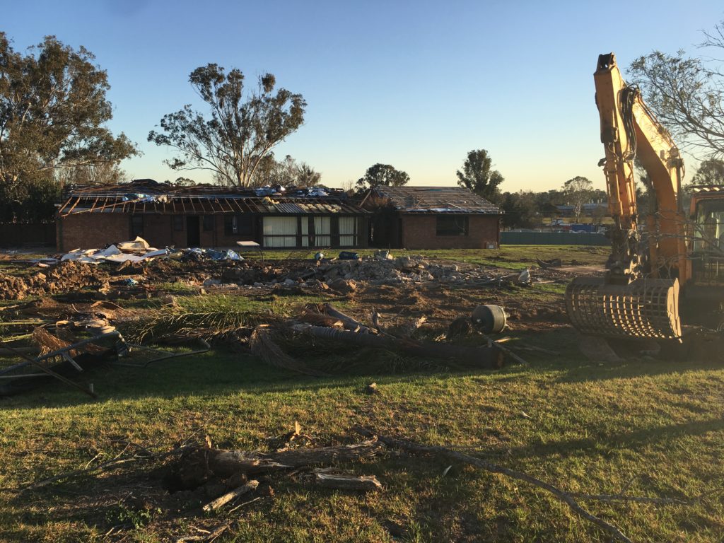 The original house at Ninth Avenue coming down