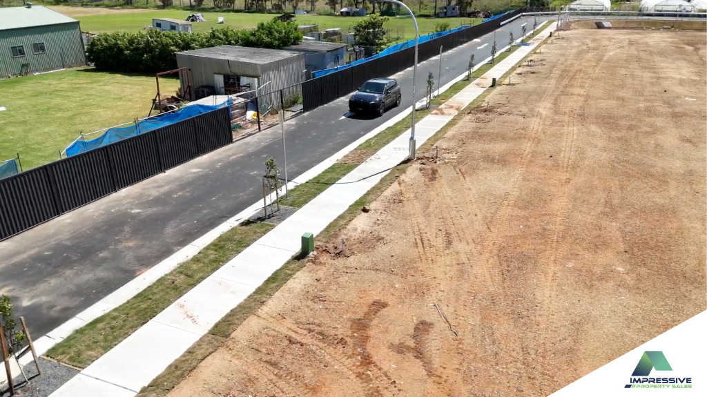 The street sealed and kerbed — Diluma at Austral
